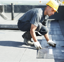 man repairing a residential flat roof