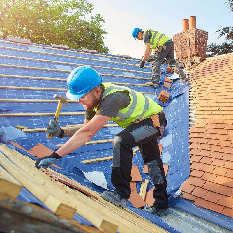 construction worker repairing roof with tools construction worker repairing roof with tools