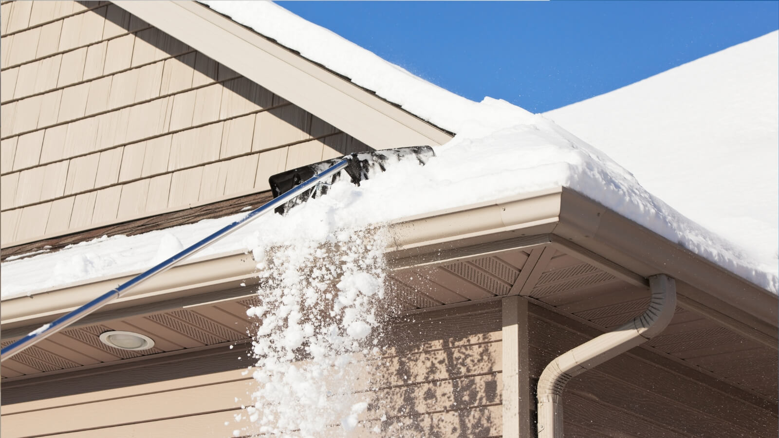 raking the roof of snow 