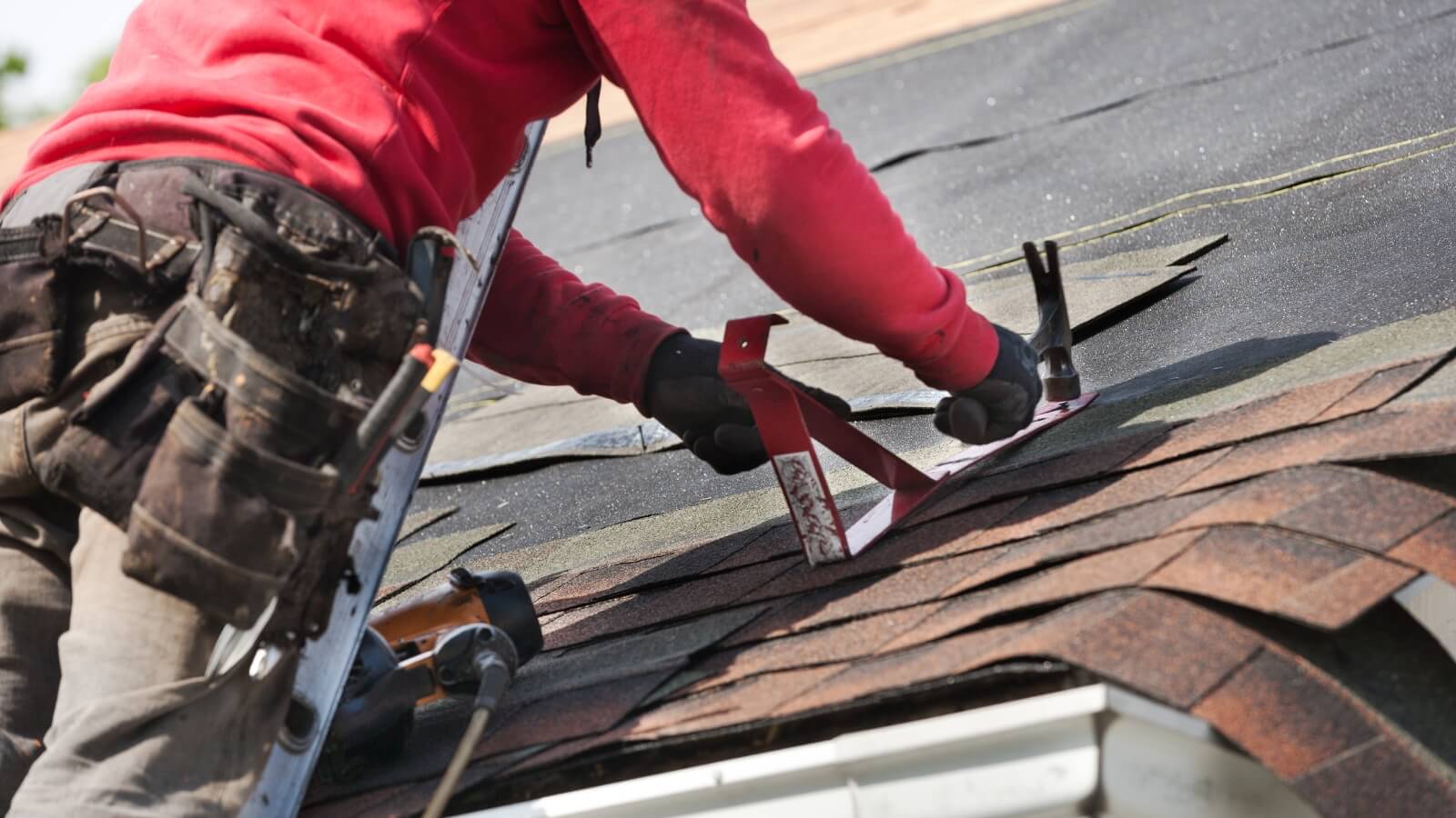 person fixing roof