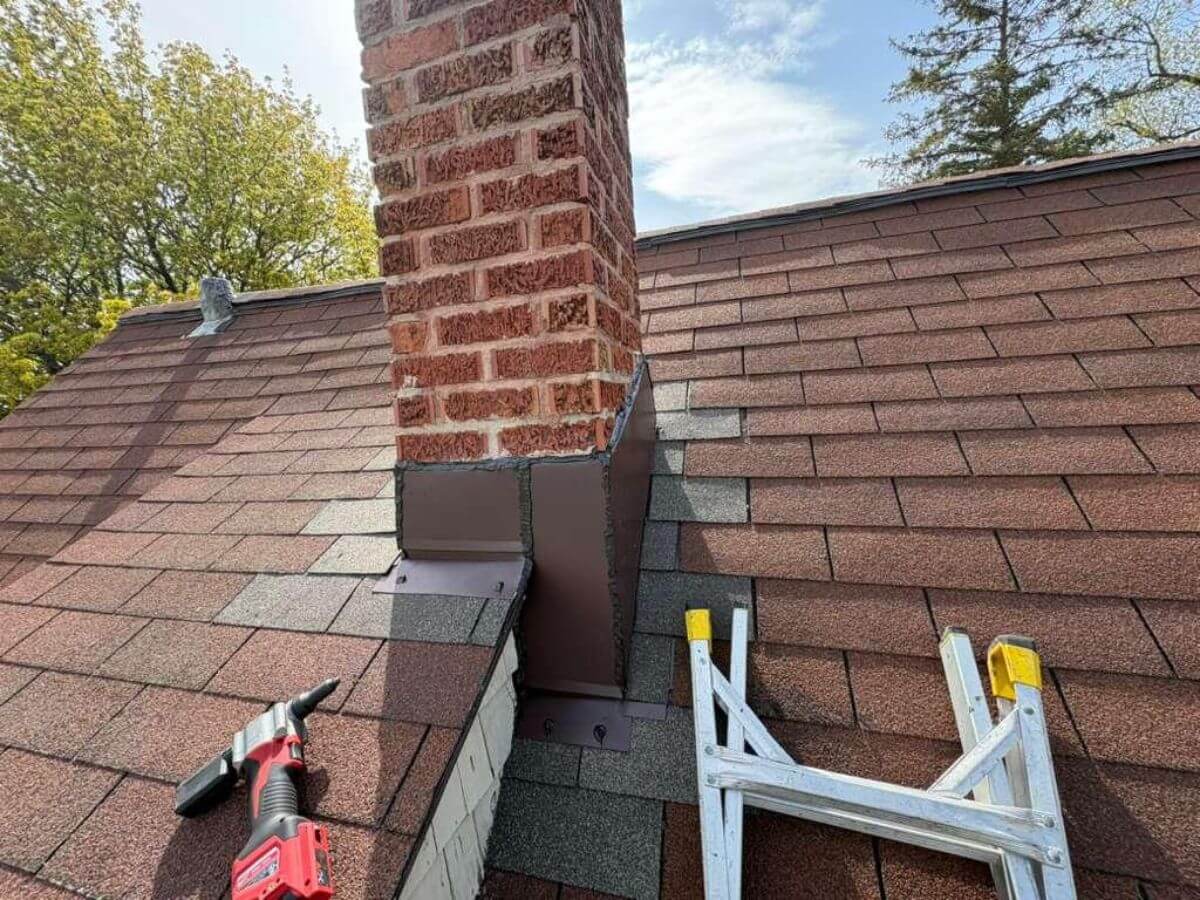 Brewster St Roof Repair after image person fixing roof