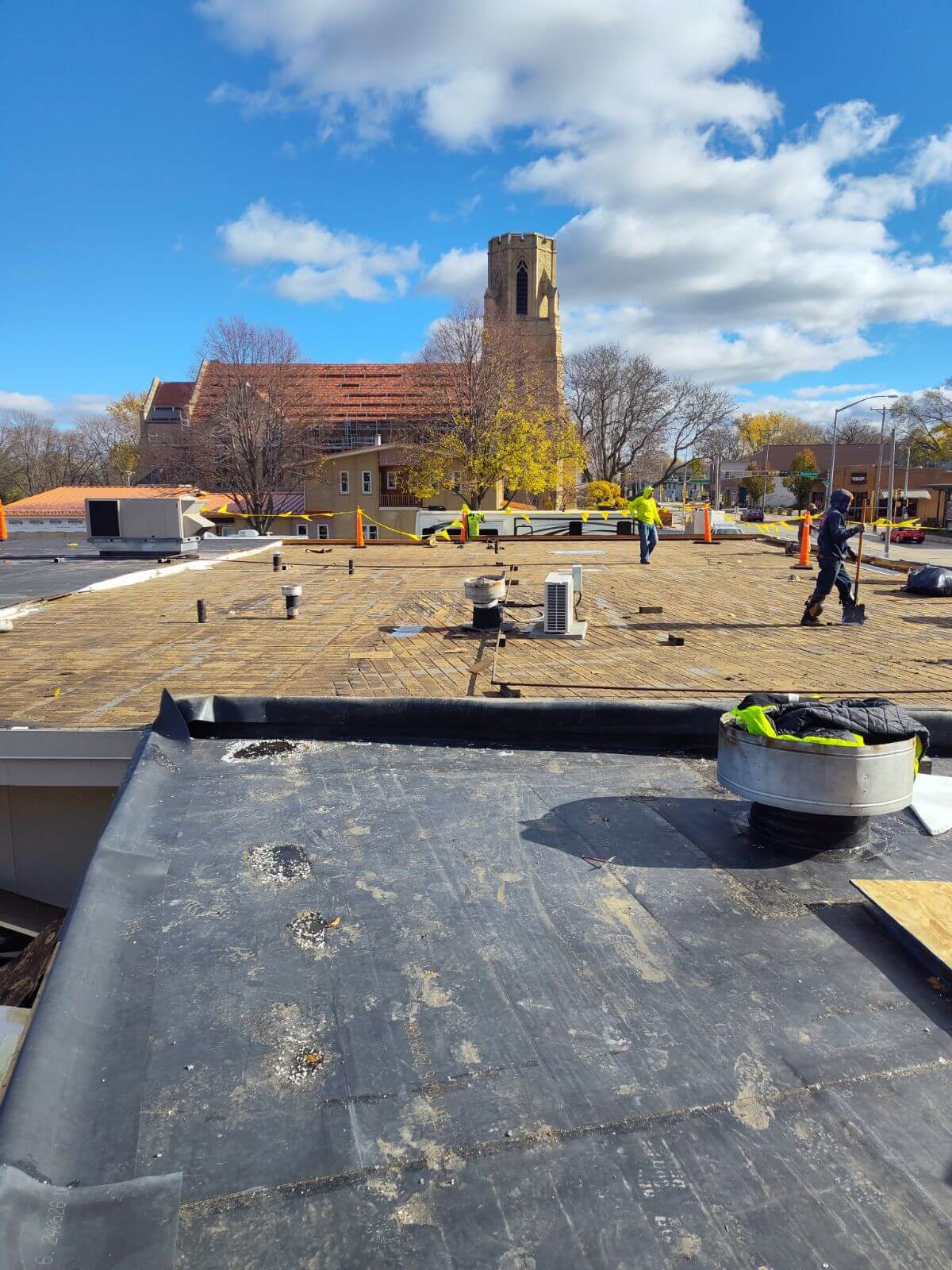 top of a commercial roof with workers on it 2