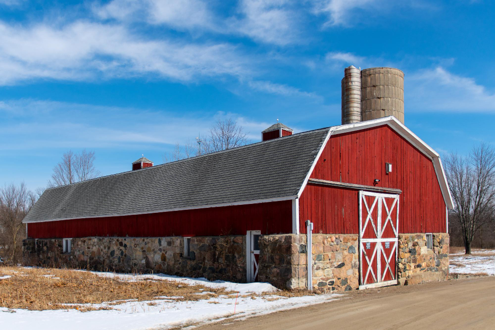 Red barn with shingle roofing