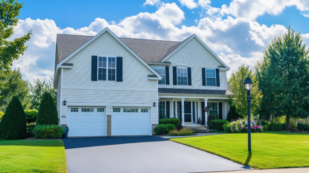 A yellow house that features a pitched roof