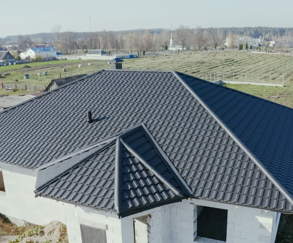 steel-roofing-materials A house with stamped steel roofing