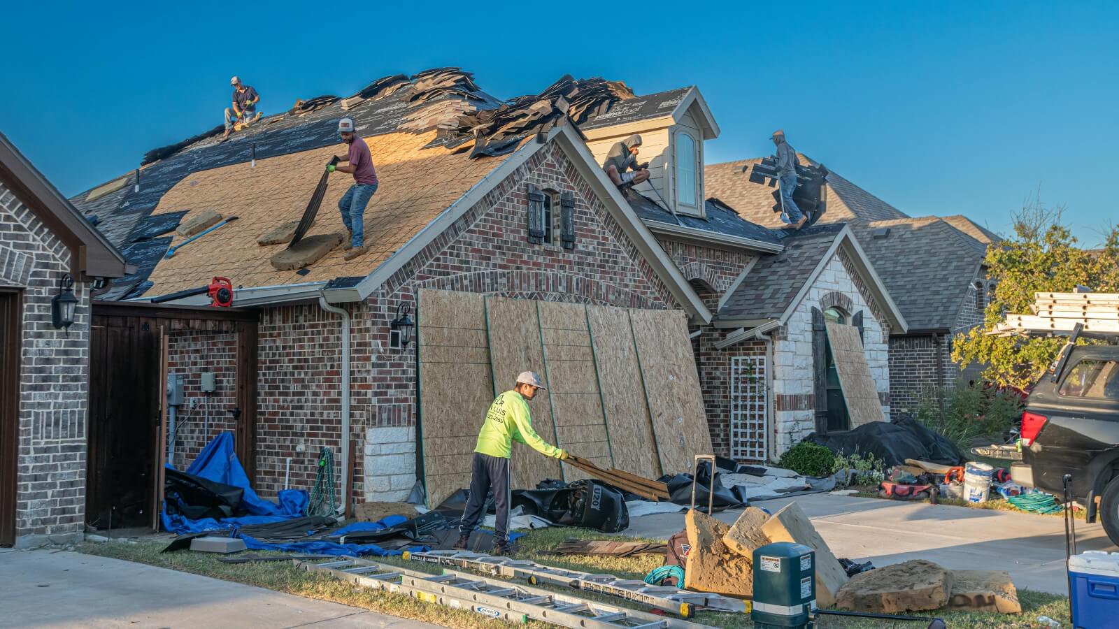 workers redecking a roof