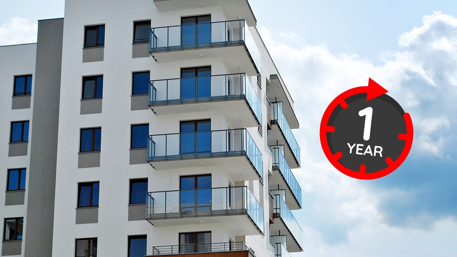 closeup of a tall building with 1 year icon over it